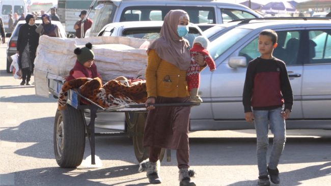 With Four Kids By Her Side, A Tajik Mother Collects Trash To Make Meager Living
