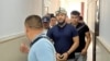 Эртая Искакова ведут в суд. 17 июля 2023 года. 