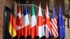 G7 անդամ երկրների դրոշները. Գերմանիա, Կանադա, Ֆրանսիա, Իտալիա, Ճապոնիա, Մեծ Բրիտանիա, ԱՄՆ և ԵՄ