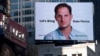 Рекламний щит на Таймс-сквер із закликом звільнити репортера Wall Street Journal Евана Гершковича, Нью-Йорк, США, 29 березня 2024 року