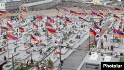 Armenia - Armenian flags fly by the graves of soldiers killed during the 2020 war in Nagorno-Karabakh, January 28, 2022.