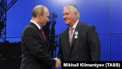 Володимир Путін та Рекс Тіллерсон, 2013
