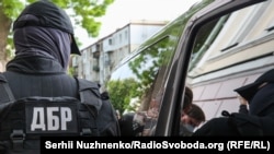 Слідчі заходи у деокупованому місті працівники ДБР проводять разом з іншими правоохоронцями (фото ілюстраційне)