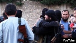 Скриншот видеозаписи о "150 казахах, уехавших в Сирию", размещенной на видеохостинге YouTube. .