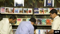 Iran - Visitors stop at the stand of Lebanon's Hezbollah group at Iran's international book fair in Tehran, 07May2005