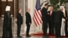 US Special Envoy to the Middle East Steve Witkoff (2nd-L) and White House Deputy Chief of Staff Stephen Miller (3rd-L) wait to greet Qatar's Emir and US President ahead of a state dinner at the Lusail Palace in Doha on May 14, 2025. (Photo by Brendan SMIA