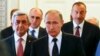 Russia - Russian President Vladimir Putin (front) walks with Azerbaijan's President Ilham Aliyev (R) and Armenian President Serzh Sargsyan (L) during their meeting in St. Petersburg, Russia, 20 June 2016