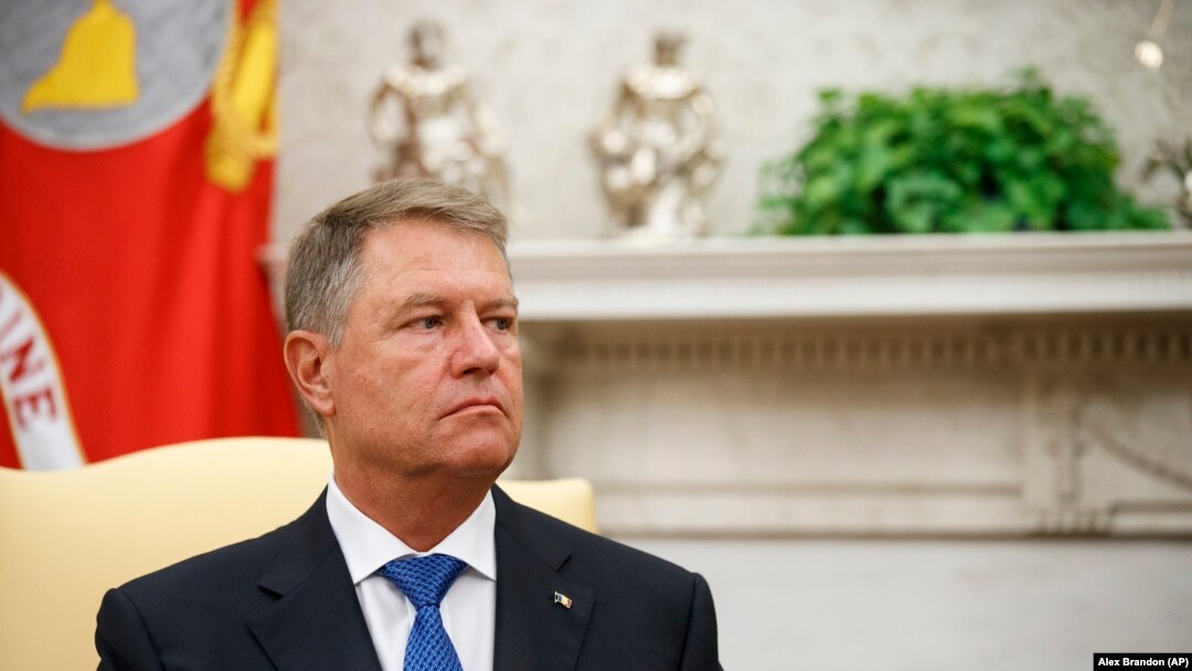 U.S. -- Romanian President Klaus Iohannis listens as President Donald Trump speaks in the Oval Office of the White House, Washington, August 20, 2019