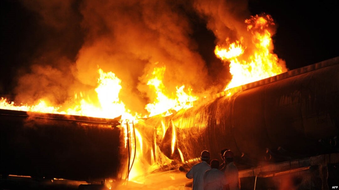 Pakistani firefighters try to extinguish burning oil tankers after gunmen attacked the NATO-bound convoy on the outskirts of Islamabad on October 4.