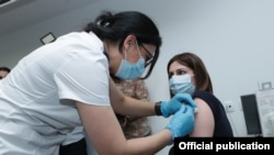 Armenia - Health Minister Anahit Avanesian is vaccinated against COVID-19 at a medical center in Yerevan, April 28, 2021.