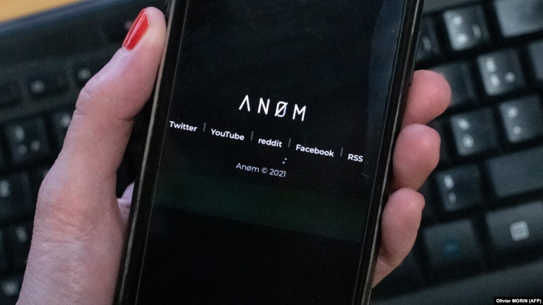 An illustration picture shows the ANoM logo displayed on the screen of an smartphone on june 8, 2021 in Paris.