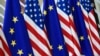 BELGIUM – This photo taken on May 15, 2017 in Brussels shows US and European Union flags at the EU headquarters. - US president Donald Trump will visit Brussels on May 25